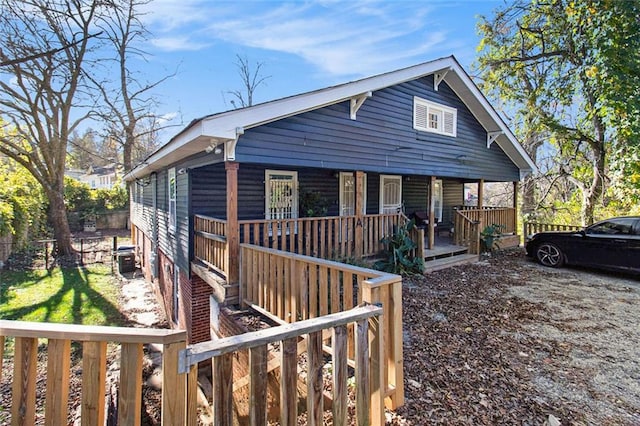 view of front of home featuring a porch and central AC