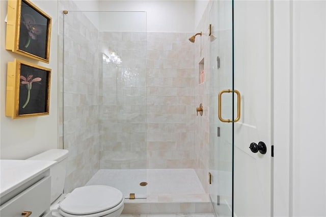 989 Bibbs Cir NW Unit 25, Atlanta, GA 30318 - bathroom featuring a stall shower, toilet, and vanity