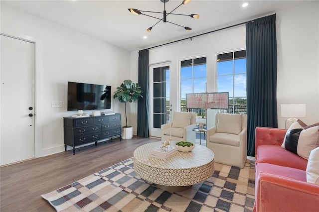 989 Bibbs Cir NW Unit 25, Atlanta, GA 30318 - living area with a chandelier, wood finished floors, and recessed lighting
