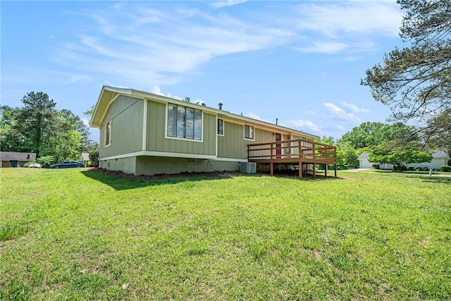 back of house featuring a lawn, a deck, crawl space, and central air condition unit