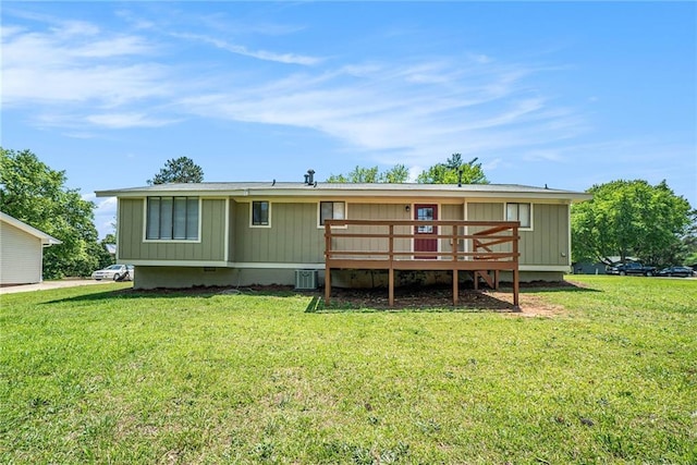 rear view of house featuring central AC unit, a wooden deck, a yard, and crawl space