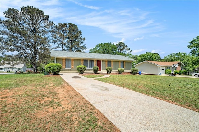 ranch-style house with concrete driveway and a front yard