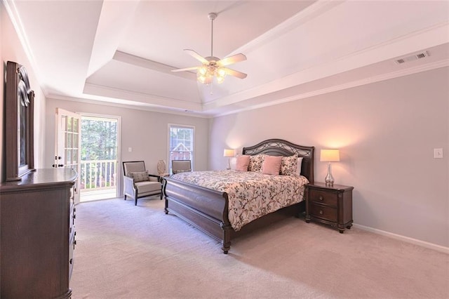 bedroom featuring light carpet, access to outside, a tray ceiling, a ceiling fan, and baseboards