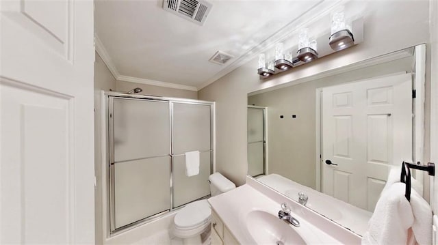 full bath with crown molding, a shower with shower door, toilet, and vanity