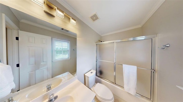 full bath with crown molding, bath / shower combo with glass door, toilet, and vanity