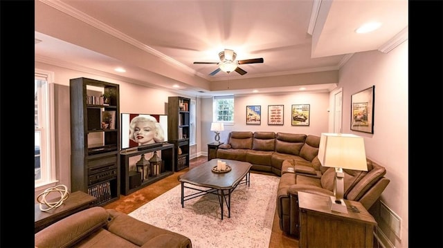 living room with a ceiling fan, crown molding, recessed lighting, and baseboards