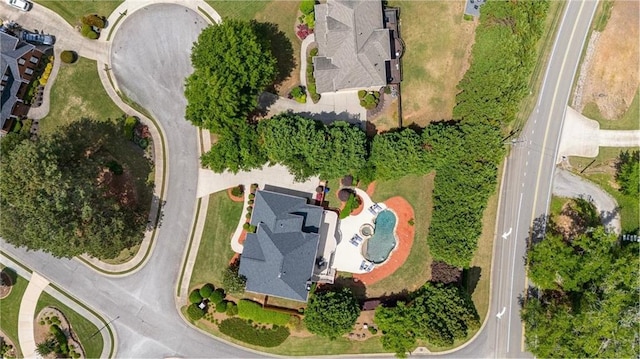 aerial view of property's location with a pool area