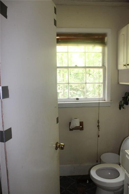 bathroom featuring tile patterned flooring and toilet