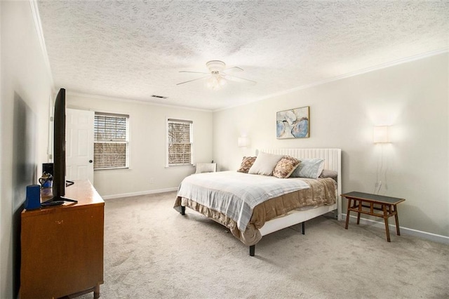 carpeted bedroom featuring crown molding, ceiling fan, and a textured ceiling