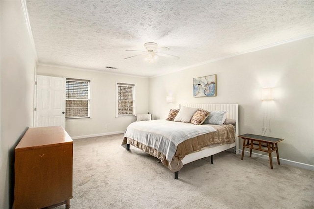 carpeted bedroom with ceiling fan, crown molding, and a textured ceiling