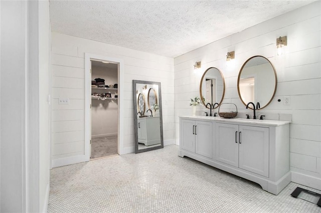 bathroom featuring vanity and a textured ceiling