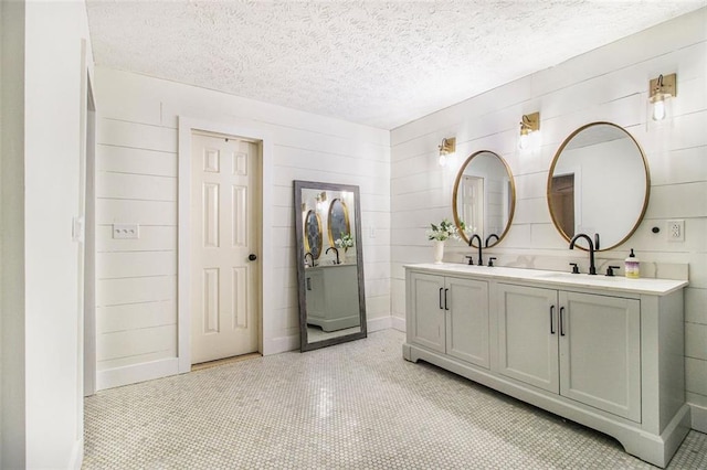 bathroom featuring vanity and a textured ceiling