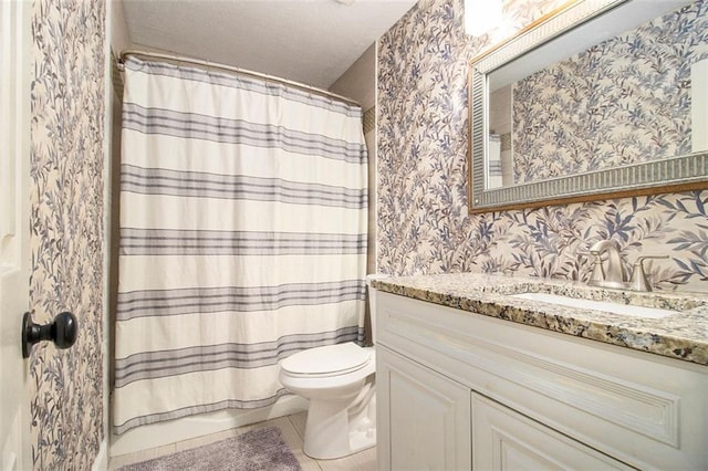 full bathroom with vanity, tile patterned floors, toilet, and shower / bath combo with shower curtain