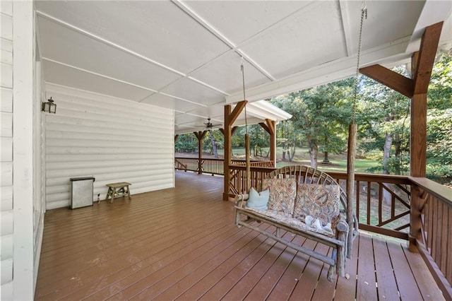 deck featuring outdoor dining space and ceiling fan