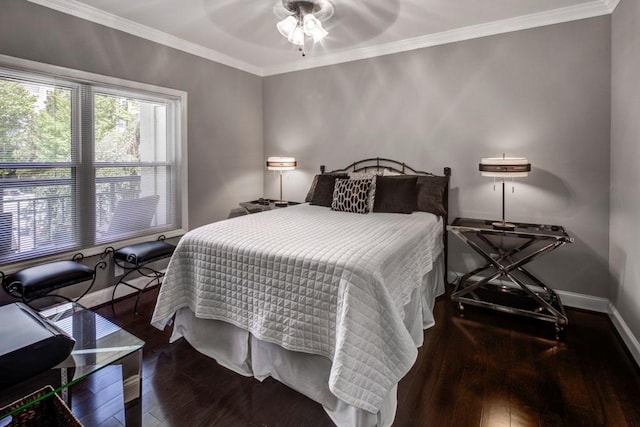 bedroom with ornamental molding, dark hardwood / wood-style floors, and ceiling fan