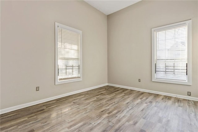 unfurnished room featuring light hardwood / wood-style floors