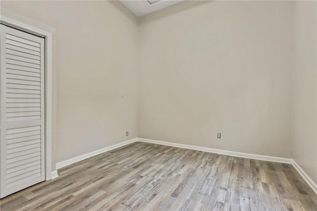 empty room with light hardwood / wood-style floors