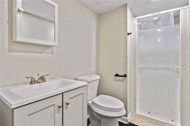 bathroom with vanity, toilet, and a shower with shower curtain