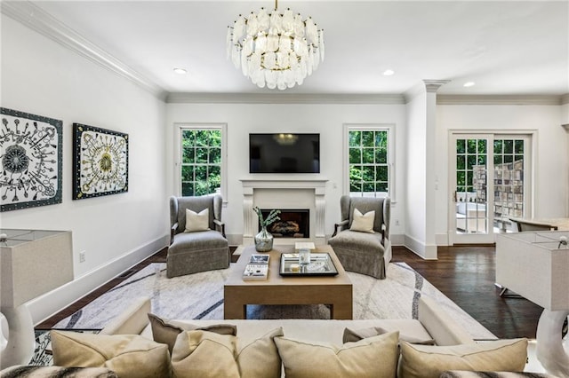 3113 Lenox Rd NE Unit 6, Atlanta, GA 30324 - living area with baseboards, a fireplace, crown molding, wood finished floors, and recessed lighting