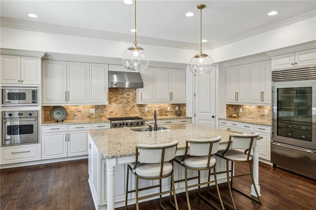 3113 Lenox Rd NE Unit 6, Atlanta, GA 30324 - kitchen with built in appliances, extractor fan, dark wood finished floors, a sink, and tasteful backsplash