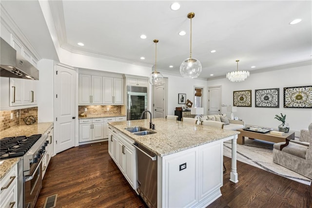 3113 Lenox Rd NE Unit 6, Atlanta, GA 30324 - kitchen featuring a sink, high quality appliances, recessed lighting, open floor plan, and a kitchen bar