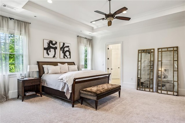 3113 Lenox Rd NE Unit 6, Atlanta, GA 30324 - bedroom featuring multiple windows, a tray ceiling, light carpet, crown molding, and recessed lighting