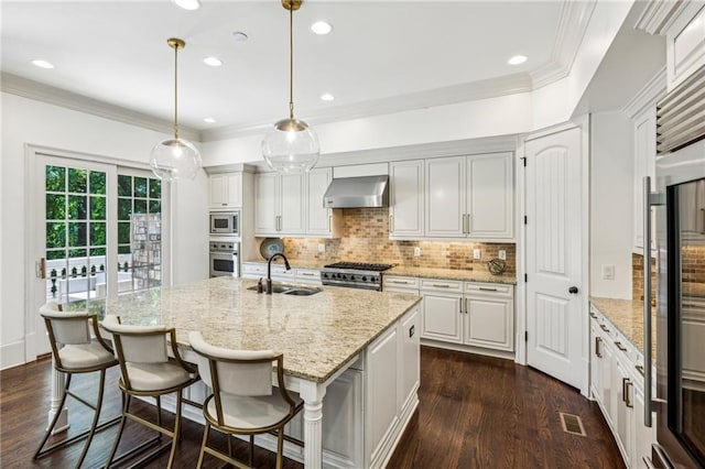 3113 Lenox Rd NE Unit 6, Atlanta, GA 30324 - kitchen featuring wall chimney exhaust hood, a sink, appliances with stainless steel finishes, dark wood-style flooring, and backsplash