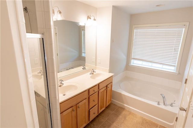 bathroom with plus walk in shower, tile patterned floors, and vanity