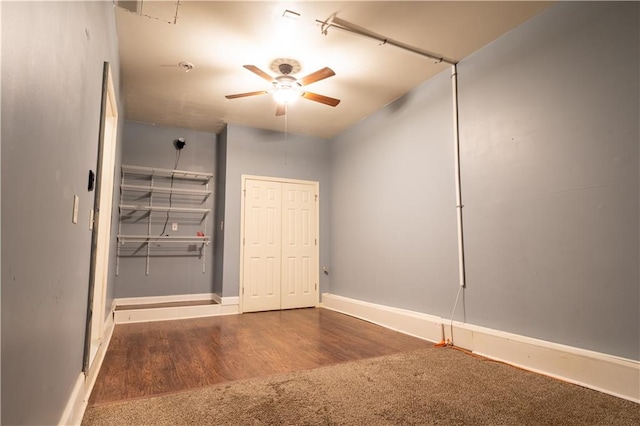 unfurnished bedroom featuring ceiling fan and wood-type flooring