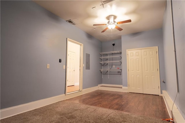 empty room featuring wood-type flooring and ceiling fan