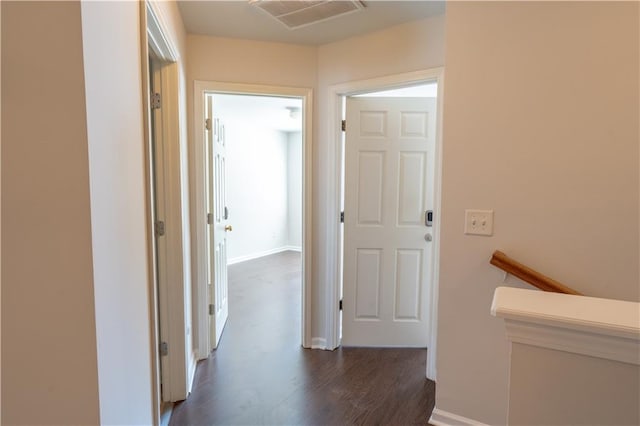 hallway featuring dark hardwood / wood-style flooring