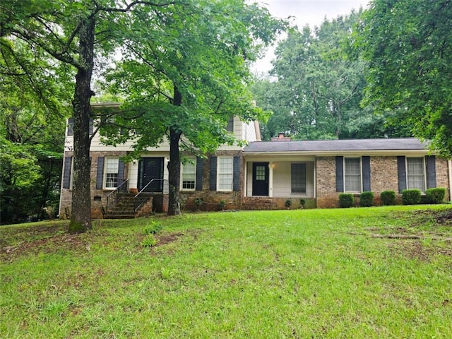 2553 Country Club Dr, Conyers, GA 30013 - view of front facade with a front yard and brick siding