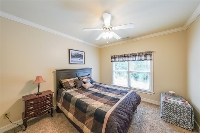 bedroom with ceiling fan, ornamental molding, and carpet floors