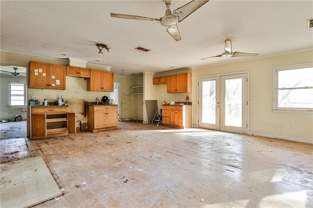 kitchen with crown molding and french doors