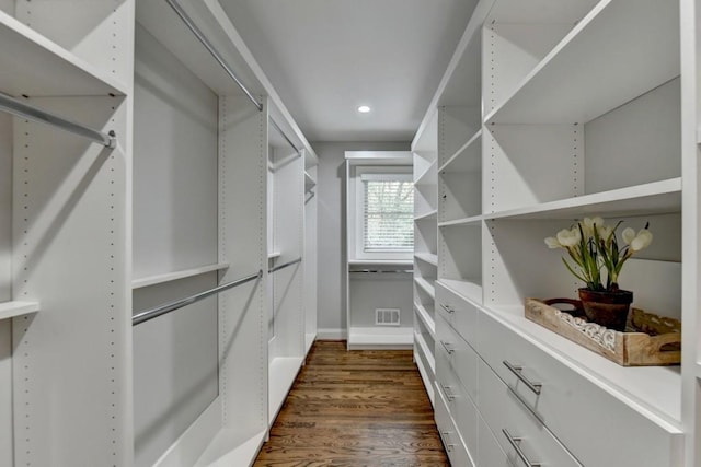 walk in closet with dark wood-style floors and visible vents