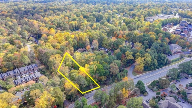 bird's eye view featuring a forest view