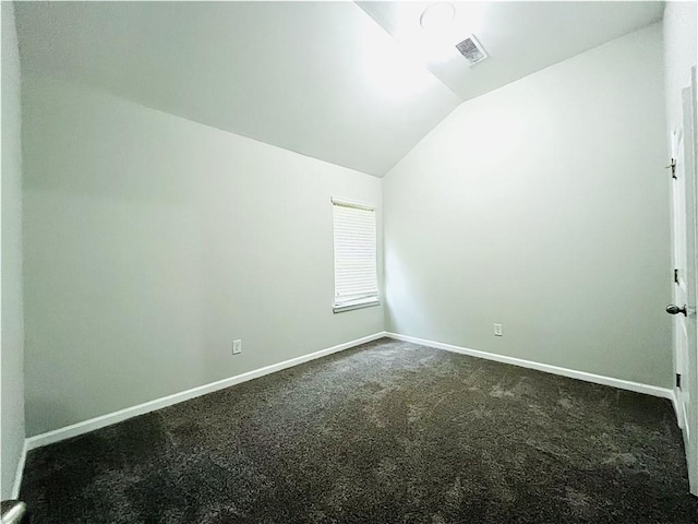 4417 Belcamp Rd, Fairburn, GA 30213 - spare room with lofted ceiling and dark carpet