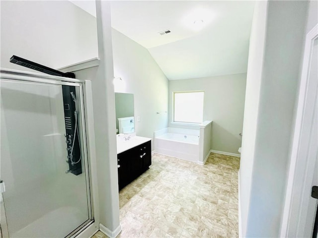 4417 Belcamp Rd, Fairburn, GA 30213 - full bath with vanity, a stall shower, a bath, and lofted ceiling
