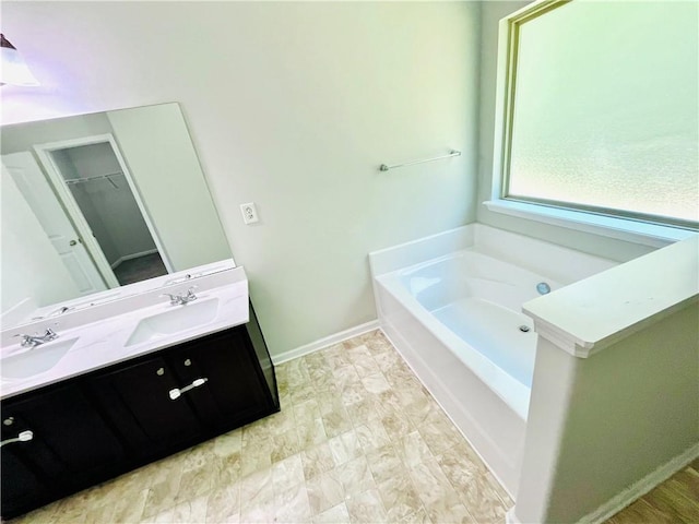 4417 Belcamp Rd, Fairburn, GA 30213 - full bath featuring double vanity, a garden tub, and a walk in closet
