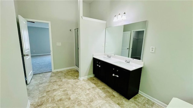 4417 Belcamp Rd, Fairburn, GA 30213 - full bathroom featuring double vanity, a high ceiling, and a shower with door