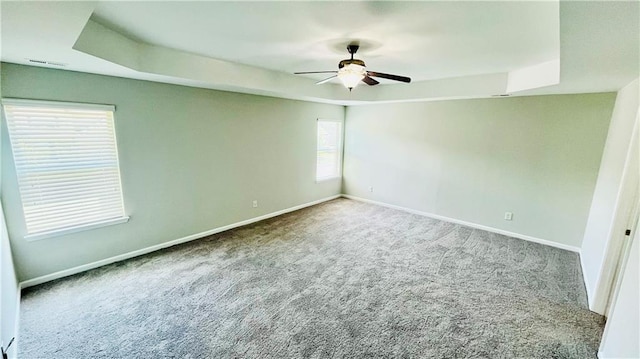 4417 Belcamp Rd, Fairburn, GA 30213 - carpeted spare room with a tray ceiling and ceiling fan