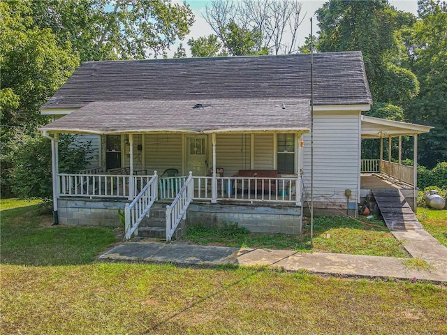 bungalow-style home with a porch and a front lawn