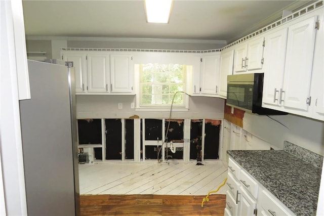 kitchen with stainless steel fridge, crown molding, white cabinets, and dark hardwood / wood-style flooring