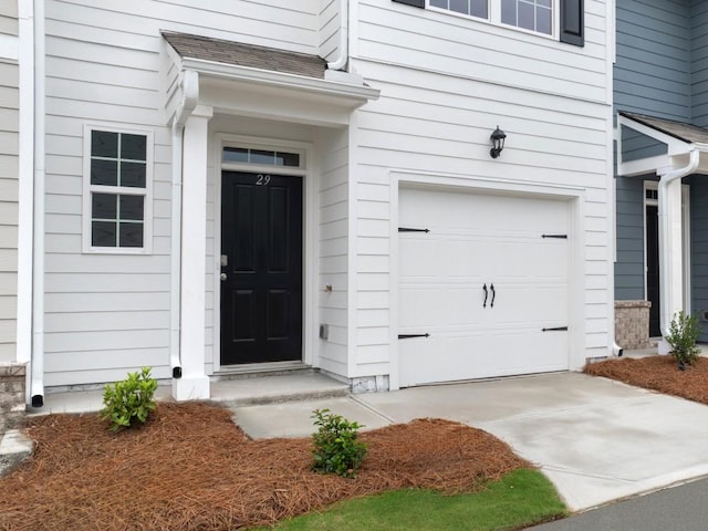 view of exterior entry featuring a garage