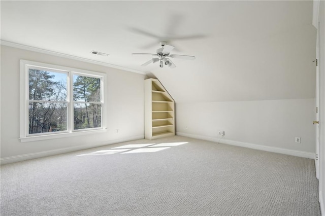 bonus room with visible vents, carpet flooring, baseboards, and a ceiling fan