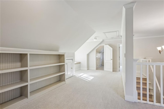 additional living space featuring attic access, baseboards, carpet floors, and vaulted ceiling