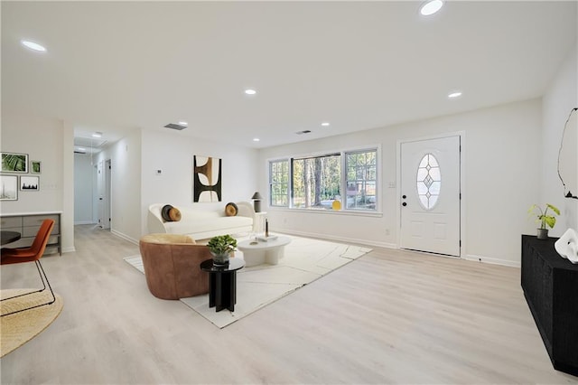 living room with light hardwood / wood-style floors