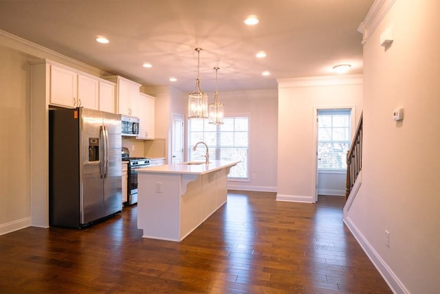 kitchen featuring backsplash, appliances with stainless steel finishes, dark wood-type flooring, and a sink