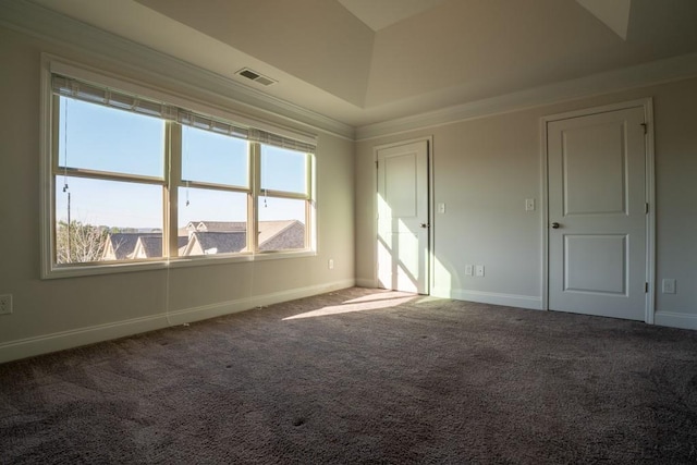 carpeted spare room with baseboards and visible vents