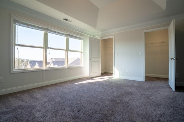 spare room featuring visible vents, baseboards, and carpet